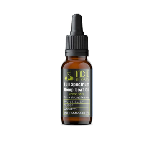 A small amber bottle with a black dropper cap labeled "INDIE EXTRACTS Full Spectrum Hemp Leaf Oil 2000 MG Extra strong formula.