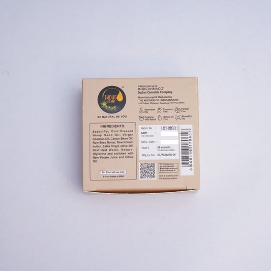 Cardboard box with branding and text on a light gray background