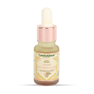A brown glass bottle of Cannarma Hemp Kumkumadi Face Oil with a white dropper cap.