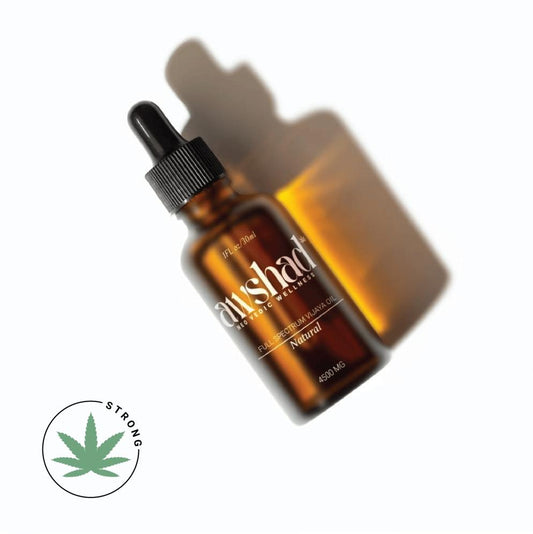 Amber glass dropper bottle of CBD oil with shadow, labeled "full-spectrum," 4500mg potency, with a "medium" leaf symbol.