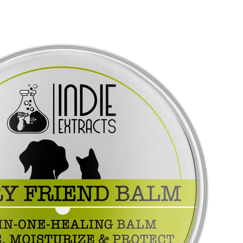 Lid of a silver tin container for Indie Extracts' pet balm, featuring brand name, silhouettes of a dog and cat, and product information.