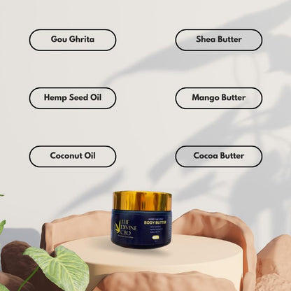 The Divine CBD body butter container with a gold lid on a beige pedestal, surrounded by ingredient names.