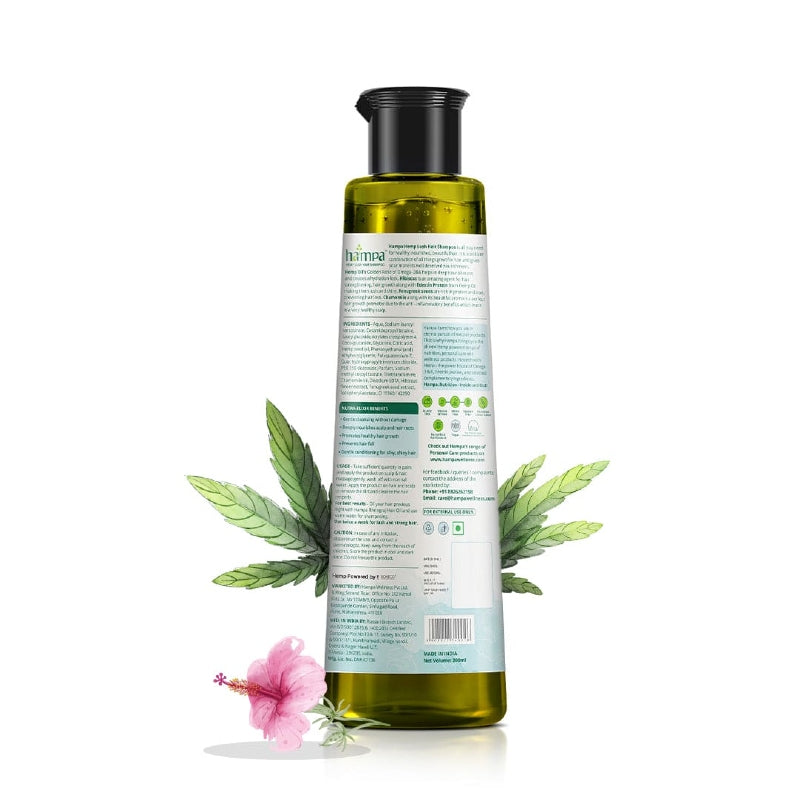 Bottle of olive oil with cannabis leaves and a pink flower on a white background