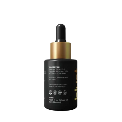 Back colour CBD Oil bottle with golden coloured cap with dripper attached.