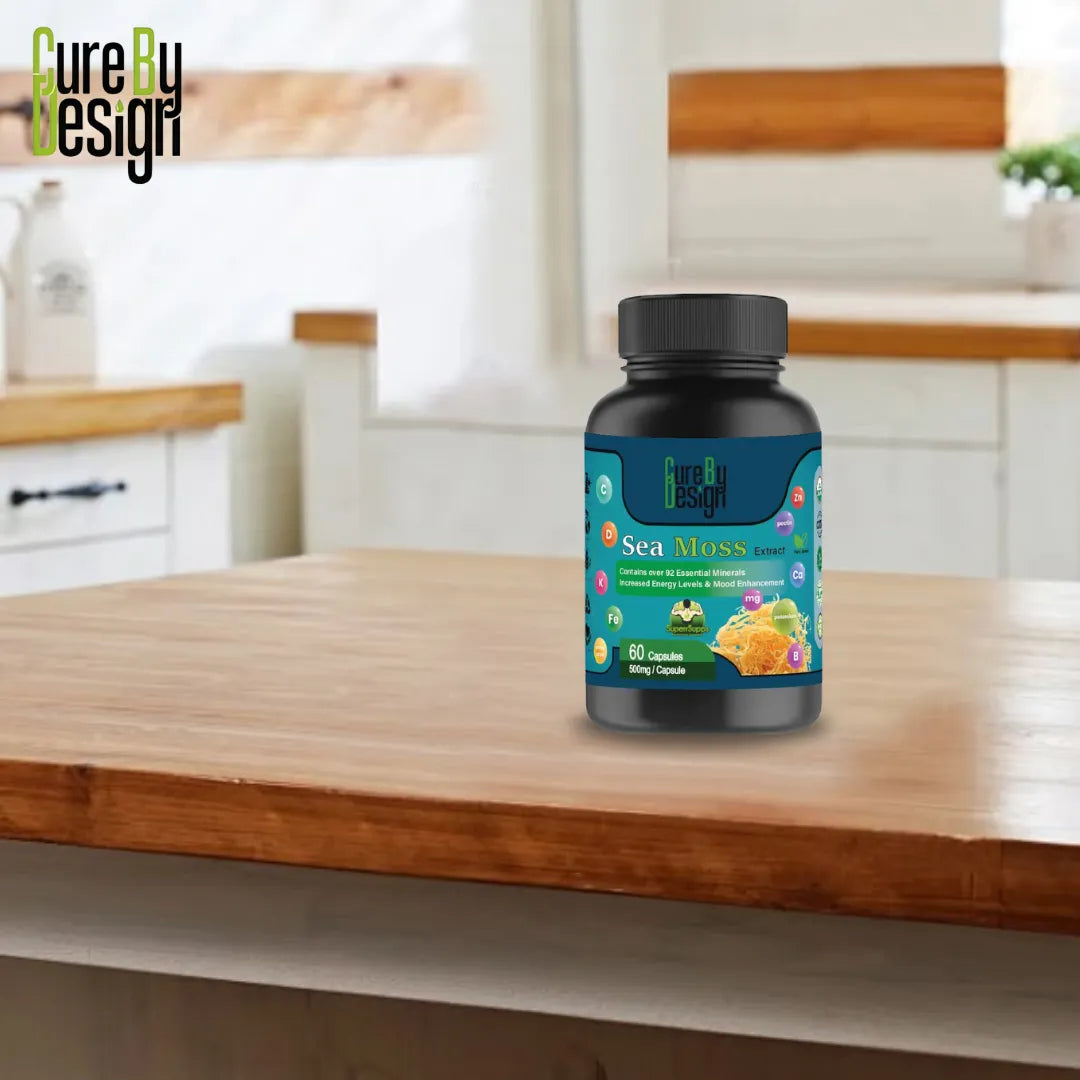 Cure By Design: Seamoss Extract 500mg | 60 Capsules supplement bottle on a wooden surface with a kitchen background