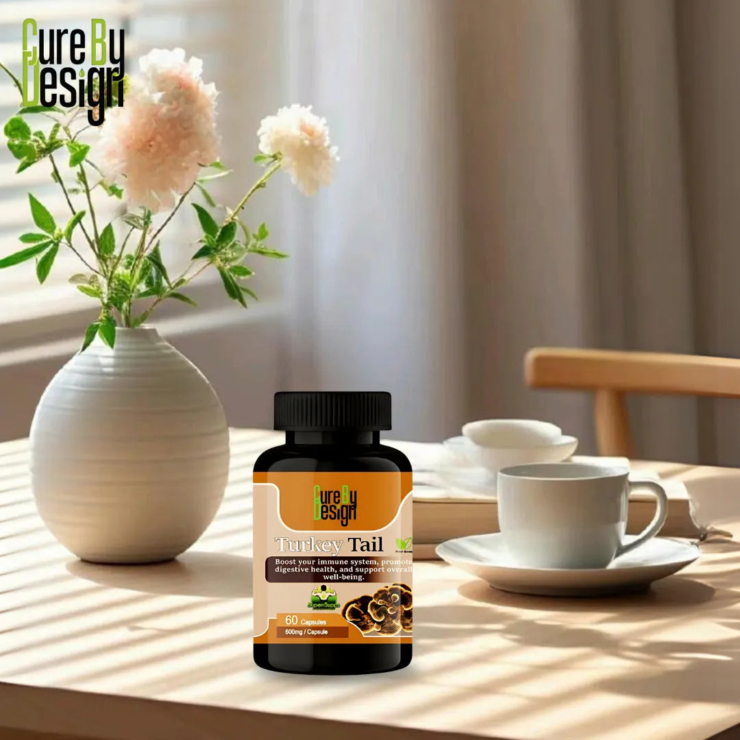 Cure By Design Turmeric Tail supplement bottle on a table with a vase of flowers and tea set.