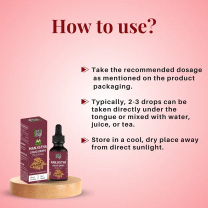 Manjistha Liquid Drops with packaging on a pink background and usage instructions.