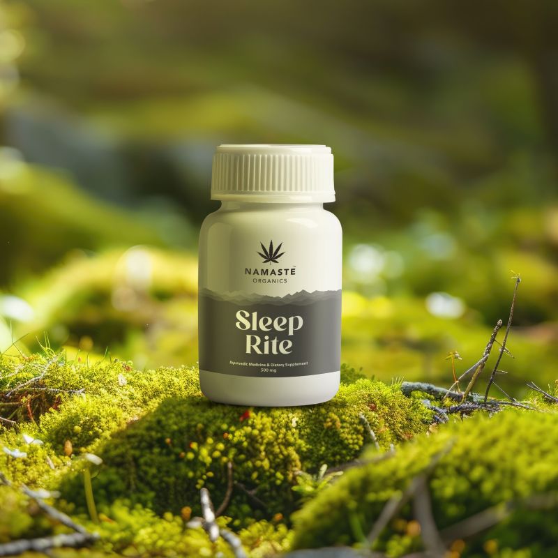 Bottle of Namaste Organics Sleep Rite Full spectrum CBD Oil tablet on a mossy surface with a blurred green natural background