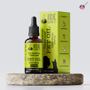 Indie Extracts Full-spectrum Vijaya Leaf Oil Bottle for Pets and packaging on a stone surface with a light gray background