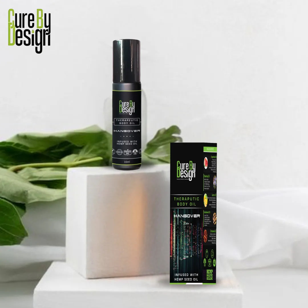 Cure by Design hemp seed oil bottle and packaging on a white background with green leaves.