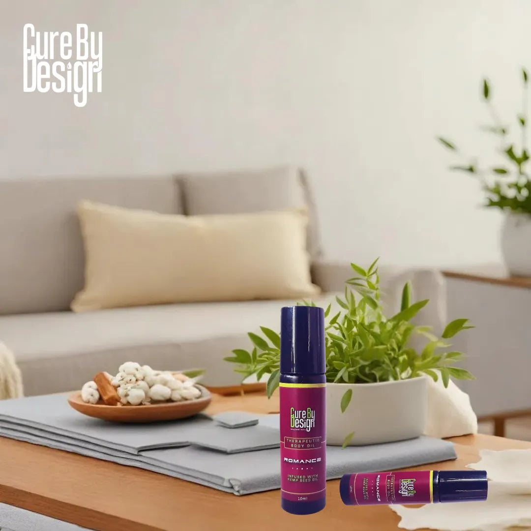 Two purple bottles labeled 'Cure By Design' on a coffee table with a living room background.