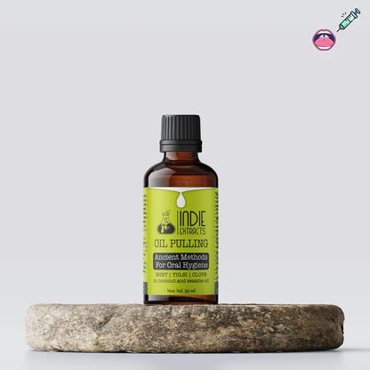 Bottle of Indie Extracts Oil Pulling on a stone surface with a white background