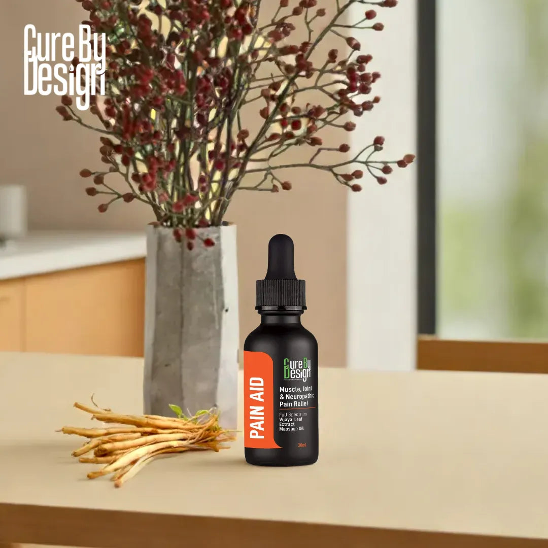 Vijaya Leaf Extract Massage Oil Paid Aid by Cure By Design product bottle with decorative elements on a table