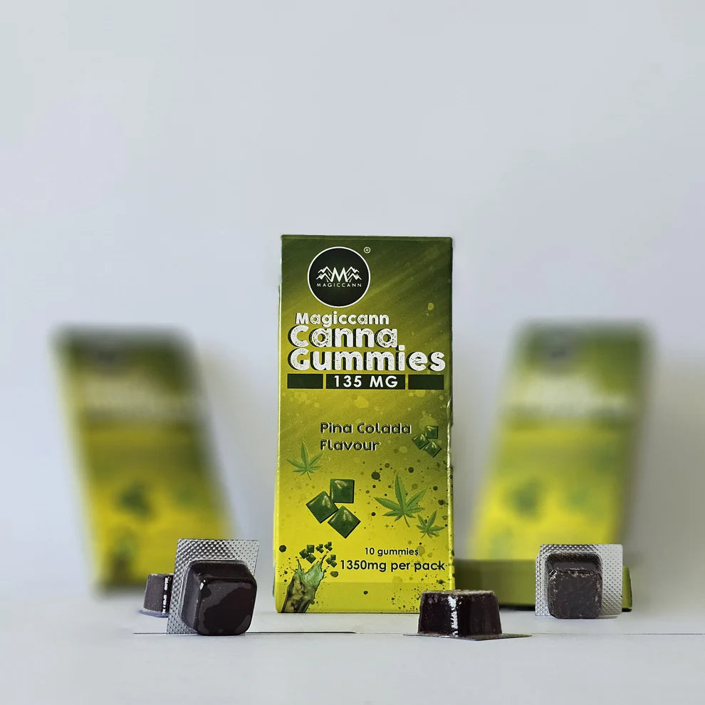 Box of Magiccann Cannabis Gummies with dark gummies in blister packs.