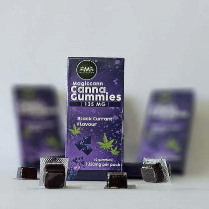 A purple package of Magiccann Cannabis CBD THC Gummies with black currant flavor and cannabis leaf design.

