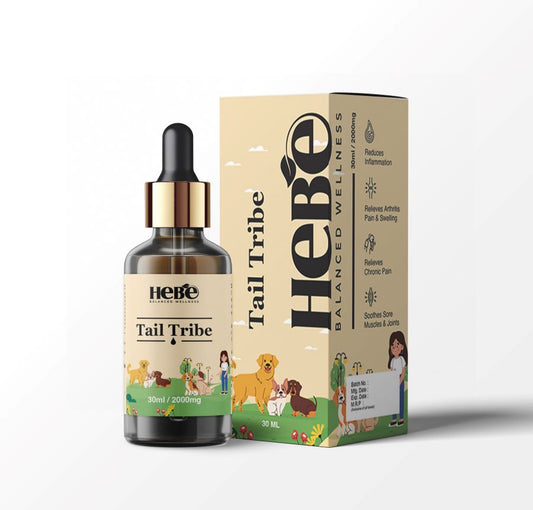 Bottle and box of Hebe Wellness Tail Tribe pet CBD oil with illustrations of animals and health benefits listed on the packaging.

